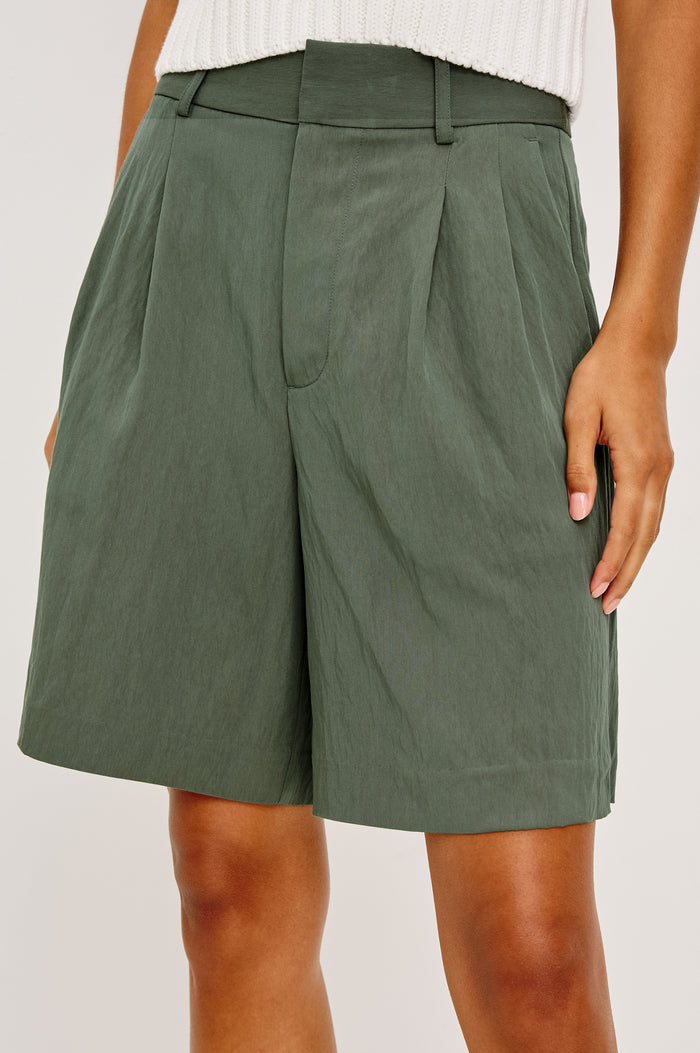 Zamora High-Waist Mid-Length Short With Front Zip Fly Belt Loops and Front Pleats in Ivy Colorway - Lower Body Front View Featured on Model